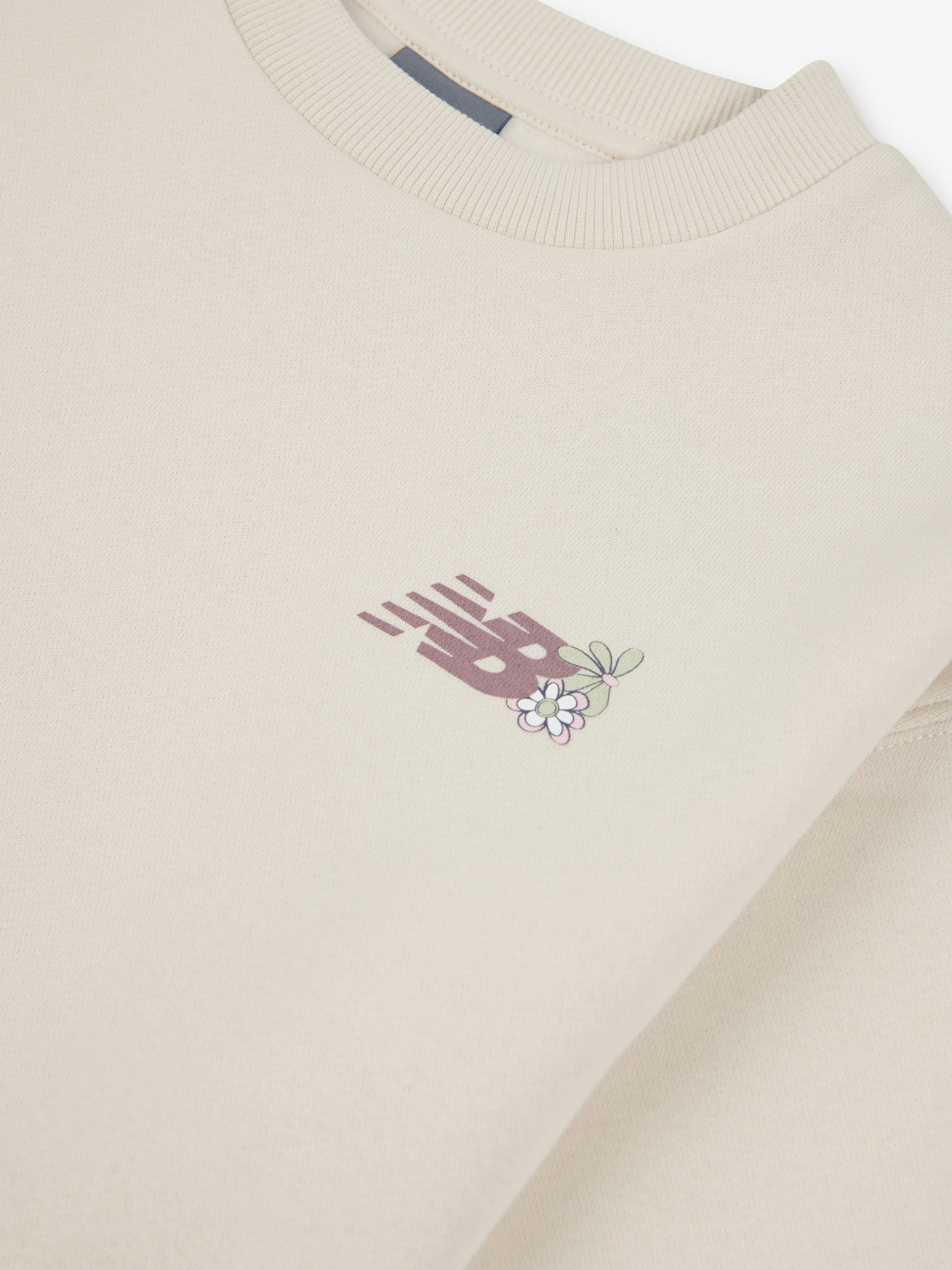 New Balance Girls Circle Blumenmuster Sweatshirt in Elfenbein
